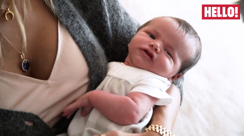 A closer look at the adorable baby and the precious necklace via Hello Magazine 